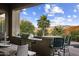 Outdoor kitchen with built-in grill, mountain views, and seating area at 27627 N 168Th St, Rio Verde, AZ 85263