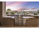 Stainless steel grill with stone countertops and scenic views at 27627 N 168Th St, Rio Verde, AZ 85263