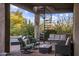 Relaxing patio with spiral staircase, seating, and lush landscaping at 27627 N 168Th St, Rio Verde, AZ 85263