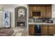 Wet bar with wine storage and a cozy fireplace at 27627 N 168Th St, Rio Verde, AZ 85263