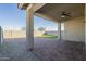 Covered patio, artificial turf, and brick pavers at 2838 W Apollo Rd, Phoenix, AZ 85041