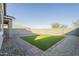 Artificial turf and brick paver backyard at 2838 W Apollo Rd, Phoenix, AZ 85041