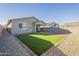 Artificial turf and brick paver backyard with covered patio at 2838 W Apollo Rd, Phoenix, AZ 85041