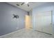 Bedroom with ceiling fan, grey walls and double doors at 2838 W Apollo Rd, Phoenix, AZ 85041