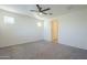 Spacious bedroom with grey carpet and ceiling fan at 2838 W Apollo Rd, Phoenix, AZ 85041