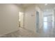 Hallway with tile flooring, leading to bathroom and living areas at 2838 W Apollo Rd, Phoenix, AZ 85041