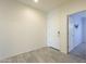 Bright hallway with tile floors and doors to other rooms at 2838 W Apollo Rd, Phoenix, AZ 85041