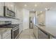 Modern kitchen featuring stainless steel appliances and granite countertops at 2838 W Apollo Rd, Phoenix, AZ 85041