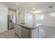 Kitchen island with granite countertops and stainless steel appliances at 2838 W Apollo Rd, Phoenix, AZ 85041