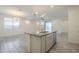 Kitchen island with granite countertop and sink, open to dining area at 2838 W Apollo Rd, Phoenix, AZ 85041