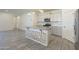 Modern kitchen with granite countertops, white cabinets and an island at 2838 W Apollo Rd, Phoenix, AZ 85041