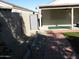 Landscaped backyard with patio and storage shed at 2845 W Angela N Dr, Phoenix, AZ 85053