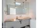 Modern bathroom with a floating vanity and skylight at 30600 N Pima Rd # 33, Scottsdale, AZ 85266