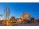 Night view of stucco home with desert landscaping at 30600 N Pima Rd # 33, Scottsdale, AZ 85266