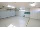 Bright and clean garage with built-in cabinets and epoxy floor at 30600 N Pima Rd # 33, Scottsdale, AZ 85266