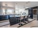 Modern kitchen with sleek cabinetry, granite counters, and large island at 30600 N Pima Rd # 33, Scottsdale, AZ 85266