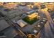 Aerial view of a single-Gathering home with a pool, horse stables, and riding arena at 30964 N Grace Ln, Queen Creek, AZ 85144