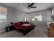 Cozy bedroom with carpeted floor and ceiling fan at 30964 N Grace Ln, Queen Creek, AZ 85144