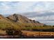 Scenic desert lot with mountain views and a wooden fence at 30964 N Grace Ln, Queen Creek, AZ 85144