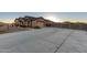 Long concrete driveway leading to a two-car garage at 30964 N Grace Ln, Queen Creek, AZ 85144