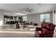 Open living room with a view of a kitchen and breakfast bar at 30964 N Grace Ln, Queen Creek, AZ 85144