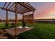 Relaxing pergola in backyard with seating area at 30964 N Grace Ln, Queen Creek, AZ 85144