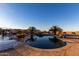 Inviting kidney-shaped pool with waterfall feature at 30964 N Grace Ln, Queen Creek, AZ 85144