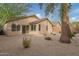 Landscaped backyard with gravel and desert plants at 3257 W Five Mile Peak Dr, San Tan Valley, AZ 85144