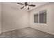 Bedroom with ceiling fan and large window with blinds at 3257 W Five Mile Peak Dr, San Tan Valley, AZ 85144