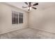 Well-lit bedroom featuring ceiling fan and window blinds at 3257 W Five Mile Peak Dr, San Tan Valley, AZ 85144