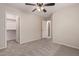 Bedroom with ceiling fan, closet, and access to a bathroom at 3257 W Five Mile Peak Dr, San Tan Valley, AZ 85144