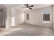 Bright bedroom with ceiling fan and neutral carpeting at 3257 W Five Mile Peak Dr, San Tan Valley, AZ 85144