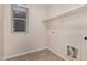 Laundry room with shelving and tile flooring at 3257 W Five Mile Peak Dr, San Tan Valley, AZ 85144