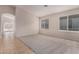 Bright living room with neutral walls and carpet at 3257 W Five Mile Peak Dr, San Tan Valley, AZ 85144