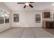 Living area with ceiling fan and kitchen views at 3257 W Five Mile Peak Dr, San Tan Valley, AZ 85144