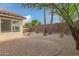 Brick paved patio area in the backyard, next to a gravel area with desert landscaping at 3257 W Five Mile Peak Dr, San Tan Valley, AZ 85144