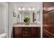 Bathroom with double vanity and large mirror at 3301 S Goldfield Rd # 4065, Apache Junction, AZ 85119