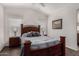 Bedroom with full-size bed, nightstands and wood framed art at 3301 S Goldfield Rd # 4065, Apache Junction, AZ 85119