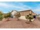 Single-wide manufactured home with landscaped yard and gravel at 3301 S Goldfield Rd # 4065, Apache Junction, AZ 85119