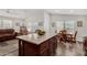 Kitchen island with granite countertops and dark wood cabinets at 3301 S Goldfield Rd # 4065, Apache Junction, AZ 85119