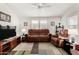 Living room with brown recliner chairs and flat screen TV at 3301 S Goldfield Rd # 4065, Apache Junction, AZ 85119