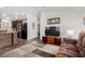 Living room with brown reclining furniture and kitchen view at 3301 S Goldfield Rd # 4065, Apache Junction, AZ 85119