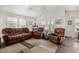 Living room with brown recliner chairs and area rug at 3301 S Goldfield Rd # 4065, Apache Junction, AZ 85119