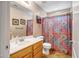 Bathroom with shower/tub combo and wood vanity at 339 E Horseshoe Ave, Gilbert, AZ 85296