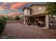 Backyard view of two-story house with patio at 339 E Horseshoe Ave, Gilbert, AZ 85296