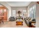 Spacious living room with gray sofas and a large window at 339 E Horseshoe Ave, Gilbert, AZ 85296