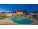 Relaxing backyard with a kidney-shaped pool and pergola at 3402 E Sunnyside Dr, Phoenix, AZ 85028