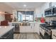 Bright kitchen featuring a farmhouse sink and white cabinets at 3402 E Sunnyside Dr, Phoenix, AZ 85028