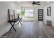 Bright living room with wood-look floors and a modern aesthetic at 3402 E Sunnyside Dr, Phoenix, AZ 85028