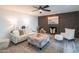 Living room featuring a brick fireplace and ceiling fan at 3402 E Sunnyside Dr, Phoenix, AZ 85028